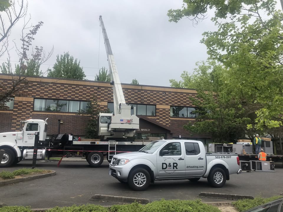 D & R truck in front of a construction site